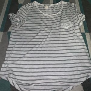 White and grey striped shirt.